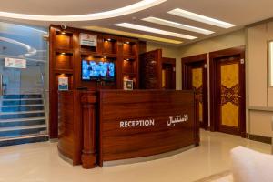 a reception area in a building with a television at ديالا للشقق المخدومة 3 in Riyadh