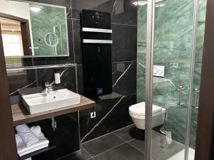 Koupelna v ubytování Villaggio Hotel