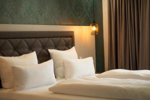 Postel nebo postele na pokoji v ubytování Villaggio Hotel