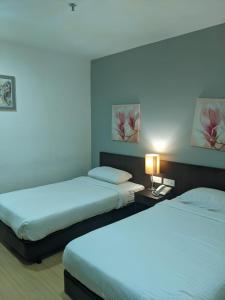 Letto o letti in una camera di The View Hotel