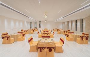 a large room with tables and chairs in it at Baantalai Resort- Baba Balak Nath Shahtalai in Changar Talai +28 photos