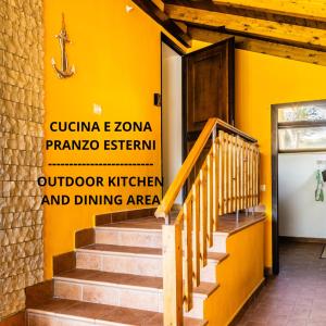 a staircase in a building with a yellow wall at 'Villa Vènere Deluxe' 50mt Sea-Free Parking-Garden in Terracina