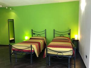 Postel nebo postele na pokoji v ubytování Agriturismo Lucchetti Ferrari