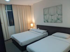 Letto o letti in una camera di The View Hotel