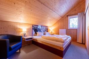 Posteľ alebo postele v izbe v ubytovaní Almdorf Stadl by ALPS RESORTS