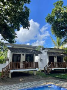 a house with a swimming pool in front of it at Edward's Bungalow in Tangalle +4 photos