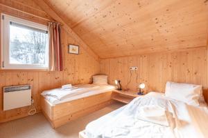 Posteľ alebo postele v izbe v ubytovaní Almdorf Stadl by ALPS RESORTS