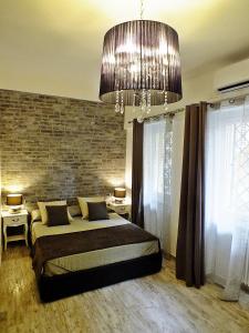 Postel nebo postele na pokoji v ubytování B&B Fiera Inn