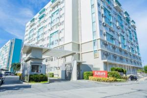 a large white building with a hotel at Unit 28 Mountain View Studio by Ems in Dumaguete