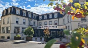a building with a sign that reads grand hotel on nord at Grand Hôtel Du Nord in Vesoul