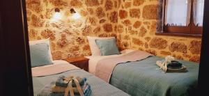 Postel nebo postele na pokoji v ubytování Νόστος