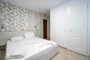 Postel nebo postele na pokoji v ubytování Vila duMio