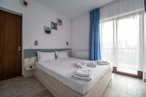 Postel nebo postele na pokoji v ubytování Vila duMio