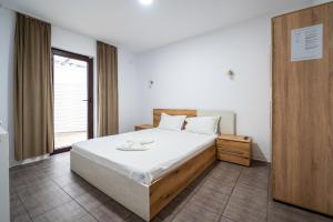 Postel nebo postele na pokoji v ubytování Vila duMio