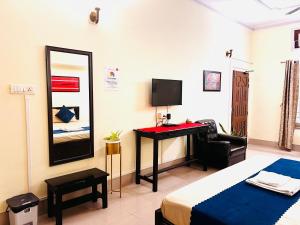 TV a/nebo společenská místnost v ubytování Okum Guest House