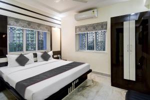 Postel nebo postele na pokoji v ubytování Townhouse TR Residence Newtown