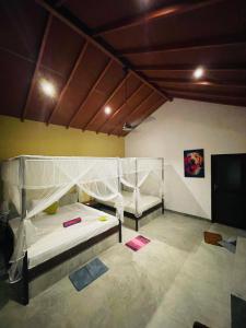 Letto o letti in una camera di Mango Tree House