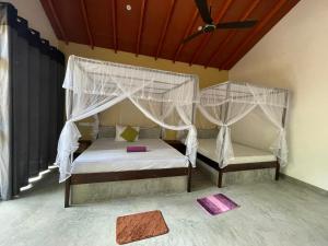 Letto o letti in una camera di Mango Tree House
