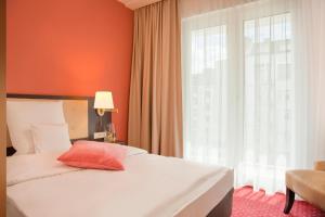 Postel nebo postele na pokoji v ubytování Gold Palais Hotel