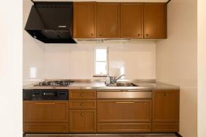 Dapur atau dapur kecil di ジブリパークまで車10分 遊べるキッズハウス1棟貸切り 敷地内無料駐車場あり 最大12名