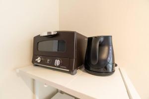 Kemudahan buat kopi dan teh di ジブリパークまで車10分 遊べるキッズハウス1棟貸切り 敷地内無料駐車場あり 最大12名