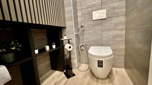 a bathroom with a toilet and a shower at Domus Altino in Rome