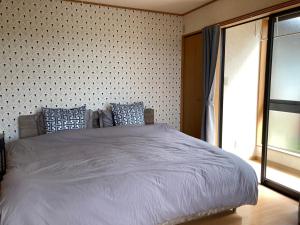 Postel nebo postele na pokoji v ubytování coco105-ルートイン新発田インターから徒歩3分