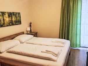 Postel nebo postele na pokoji v ubytování Apartment Schönblick Mountain Resort & Spa-1 by Interhome