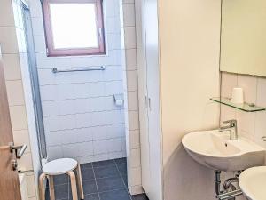 a bathroom with a sink and a toilet at Apartment Schönblick Mountain Resort & Spa-1 by Interhome in Rauris