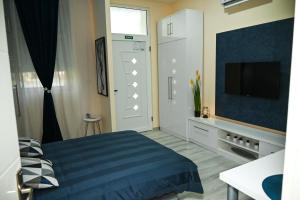 Voodi või voodid majutusasutuse Blue apartment toas