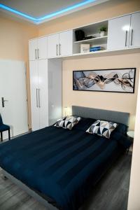 Voodi või voodid majutusasutuse Blue apartment toas