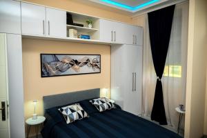 Voodi või voodid majutusasutuse Blue apartment toas