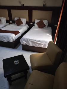 Postel nebo postele na pokoji v ubytování Gardenia Hotel
