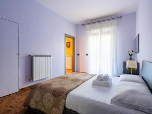 Ένα ή περισσότερα κρεβάτια σε δωμάτιο στο Apartment Arancia by Interhome