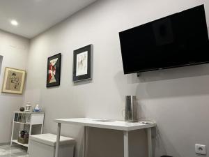 TV a/nebo společenská místnost v ubytování Loft El Capricho Grupo Ac Gestion