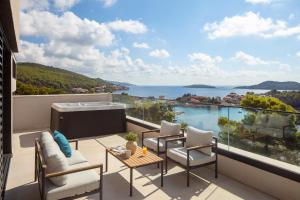 a balcony with a view of the water at Aminess Alfir Hotel in Blato