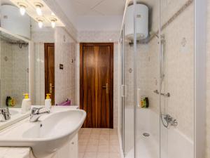 a bathroom with a sink and a shower at Apartment SunnyLake by Interhome in Riva del Garda