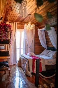 Postel nebo postele na pokoji v ubytování Cabana Recanto da Araucária
