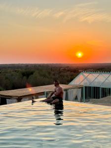 The sunrise or sunset as seen from the country house or nearby