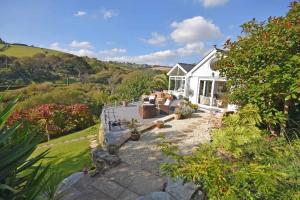 an aerial view of a white house at Beach Front House with Stunning Sea Views and Free Use of a Local Indoor Pool in Talland