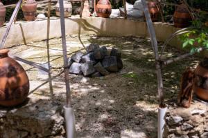 a pile of rocks sitting next to some plants at Lovely Villa 1-BR Villa Miguel in Chemuyil