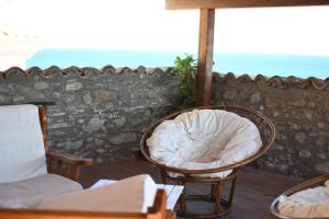 a room with a chair and a couch and a table at B&B L'Arcangelo in Cariati