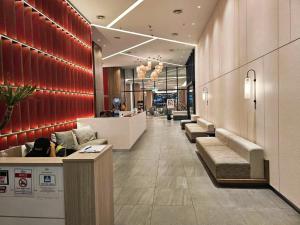 a lobby of a hotel with couches and a counter at Seaview suite@The Shore Figures Kota Kinabalu in Kota Kinabalu