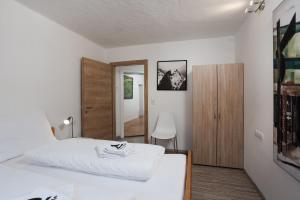 Postel nebo postele na pokoji v ubytování Alpine View Apartments