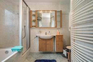 a bathroom with a sink and a mirror at Mein lieber Schwan in Lindau +18 photos