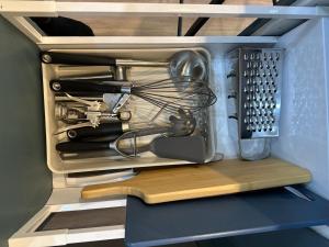 a kitchen utensils are inside of a refrigerator at Charming 1 bed - near Marlow in Sands
