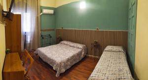 A bed or beds in a room at Al Duomo