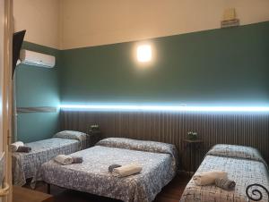 A bed or beds in a room at Al Duomo
