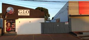 a building with a sign on the side of it at Apartamento Loft Confort 02 in Ponta Porã