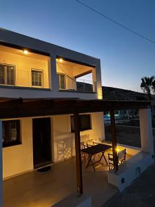 a view of a house with a table on a patio at Stelios House in Pserimos in Psérimos